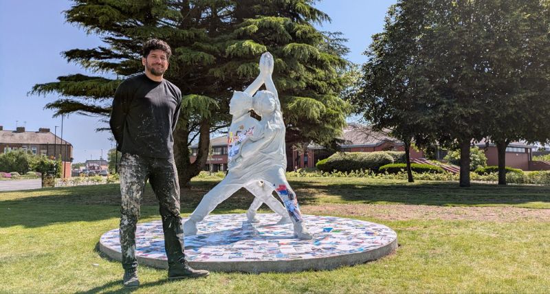 Artist Aaron Li-Hill with the Our Woven Voices artwork