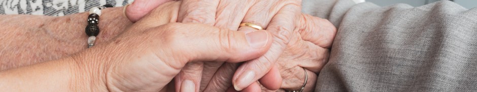 Older people holding hands