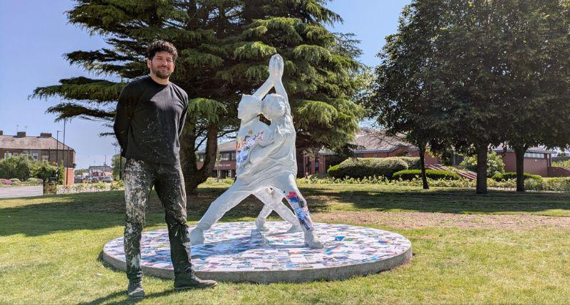 Artist Aaron Li-Hill with the Our Woven Voices artwork