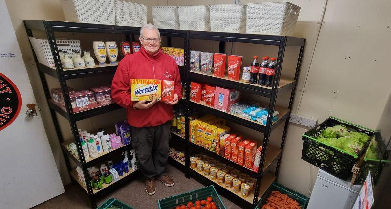 Alan Nixon from Out of Sight stocking the new social supermarket in Dudley.